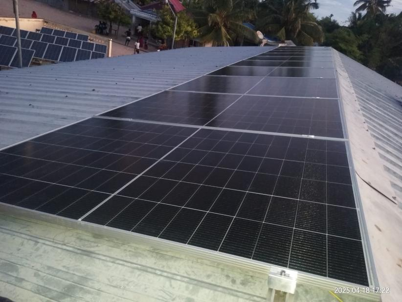solar panels installed on a tin roof in Mozambique
