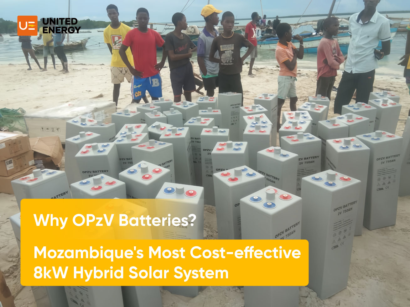 OPZV batteries for a solar system in Mozambique are stacked on the beach as locals stop to watch.